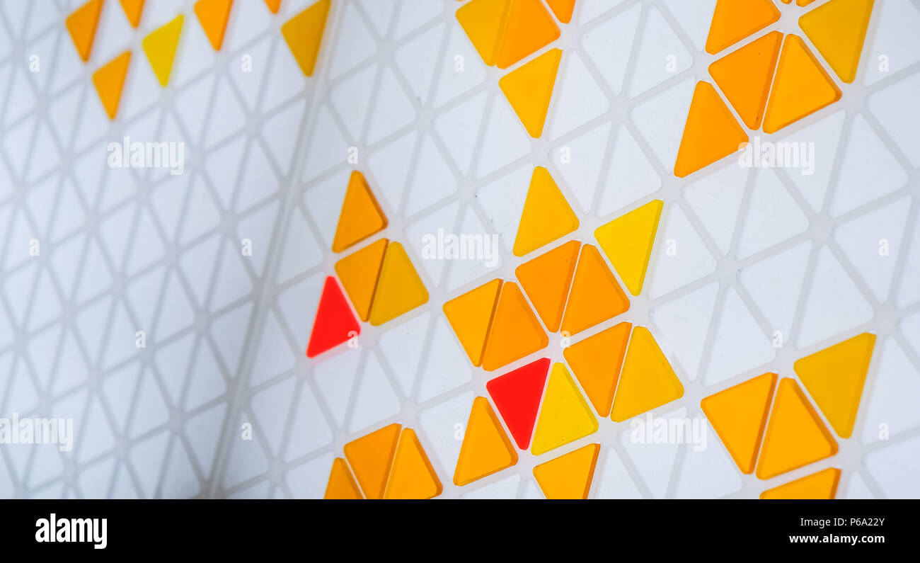 Puzzle made of colored glass with triangular shapes Stock Photo