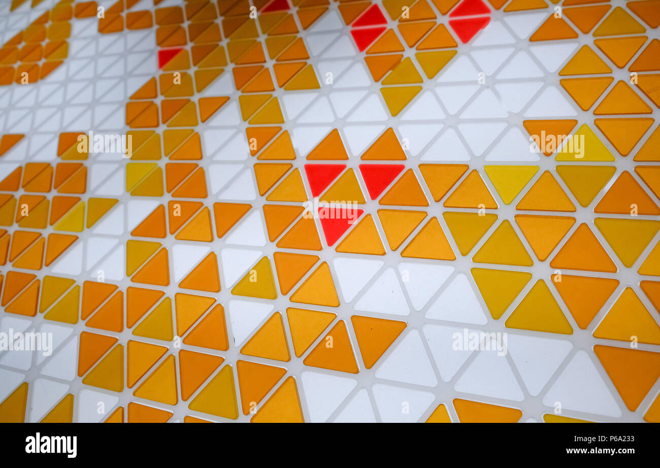 Puzzle made of colored glass with triangular shapes Stock Photo