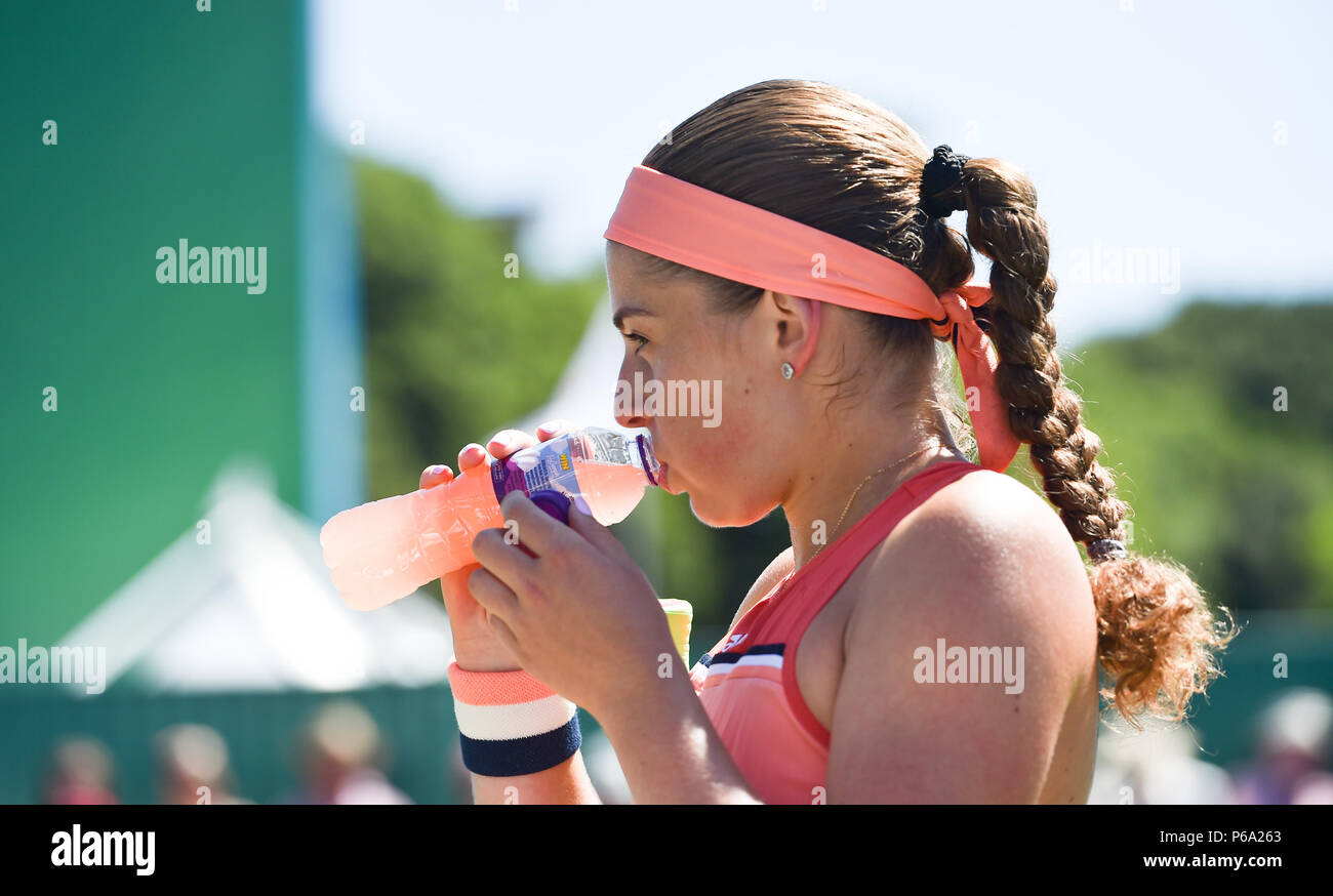 Jelena Ostapenko of Latvia takes a drink in her match against Kaia Kanepi  of Estonia during the Nature Valley International tennis tournament at Devonshire Park in Eastbourne East Sussex UK. 26 June 2018 Stock Photo