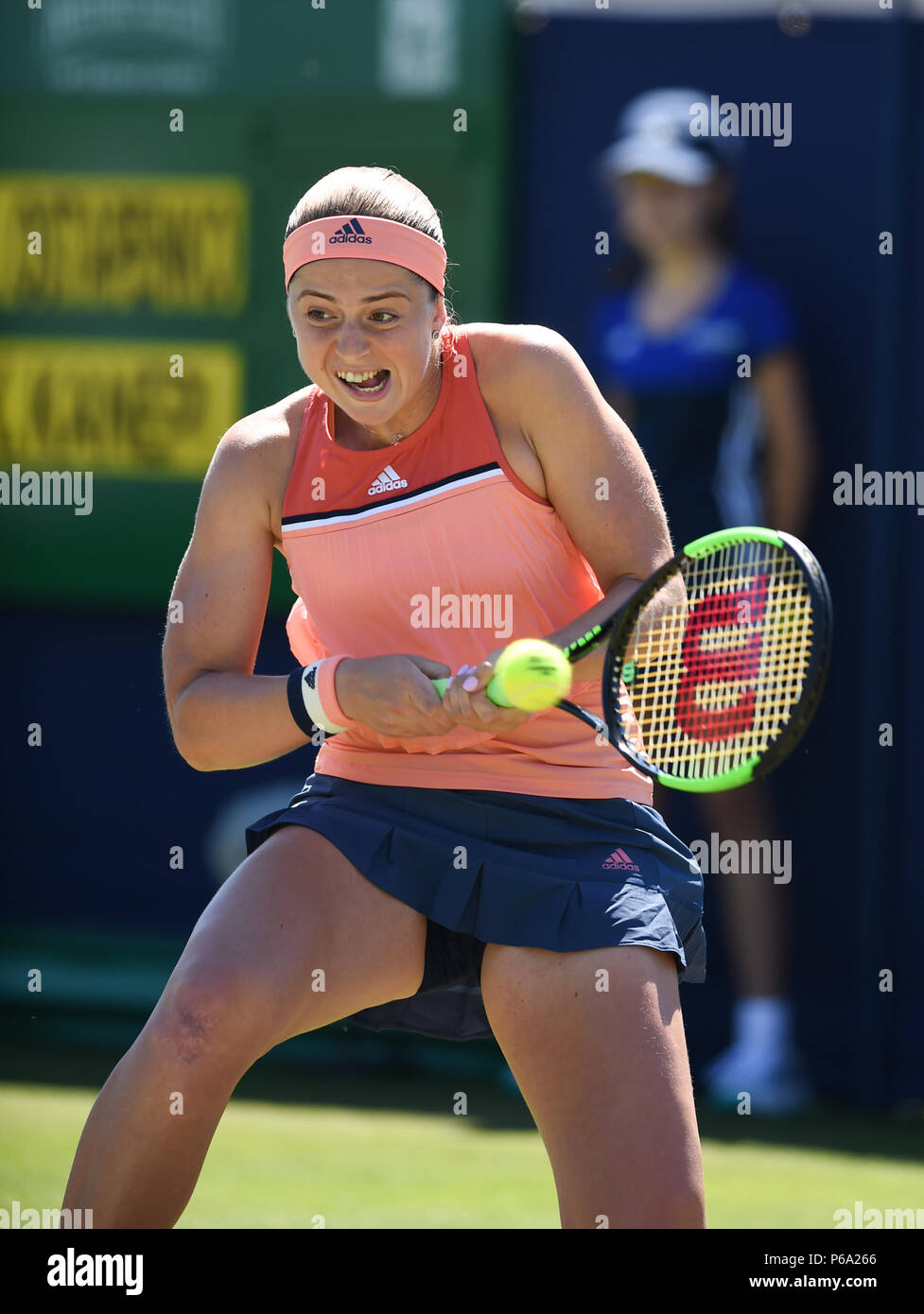 Jelena Ostapenko of Latvia in action against Kaia Kanepi  of Estonia during the Nature Valley International tennis tournament at Devonshire Park in Eastbourne East Sussex UK. 26 June 2018 Stock Photo