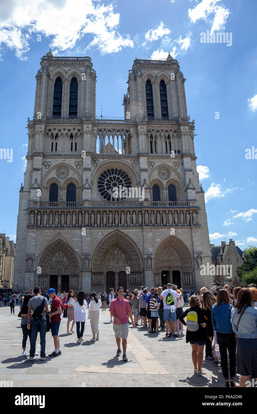 Tourists Queue to Enter Notredame Cathedral in Paris, France Stock Photo