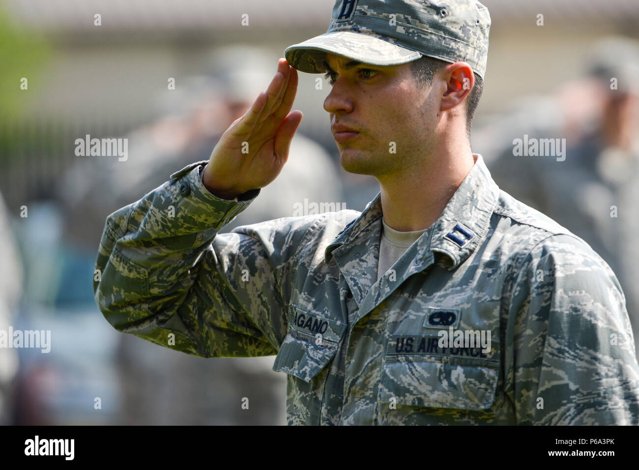 Capt. Alexander Pagano, a 89th Maintenance Group maintenance officer and 89th Airlift Wing executive officer, salutes as the National Anthem was sung and the American flag was lowered during a Memorial Day retreat ceremony at the 89th AW headquarters building at Joint Base Andrews, Md., May 26, 2016. Memorial Day is an American federal holiday to remember those who died while serving in the U.S. armed forces. (U.S. Air Force photo by Senior Master Sgt. Kevin Wallace/RELEASED) Stock Photo