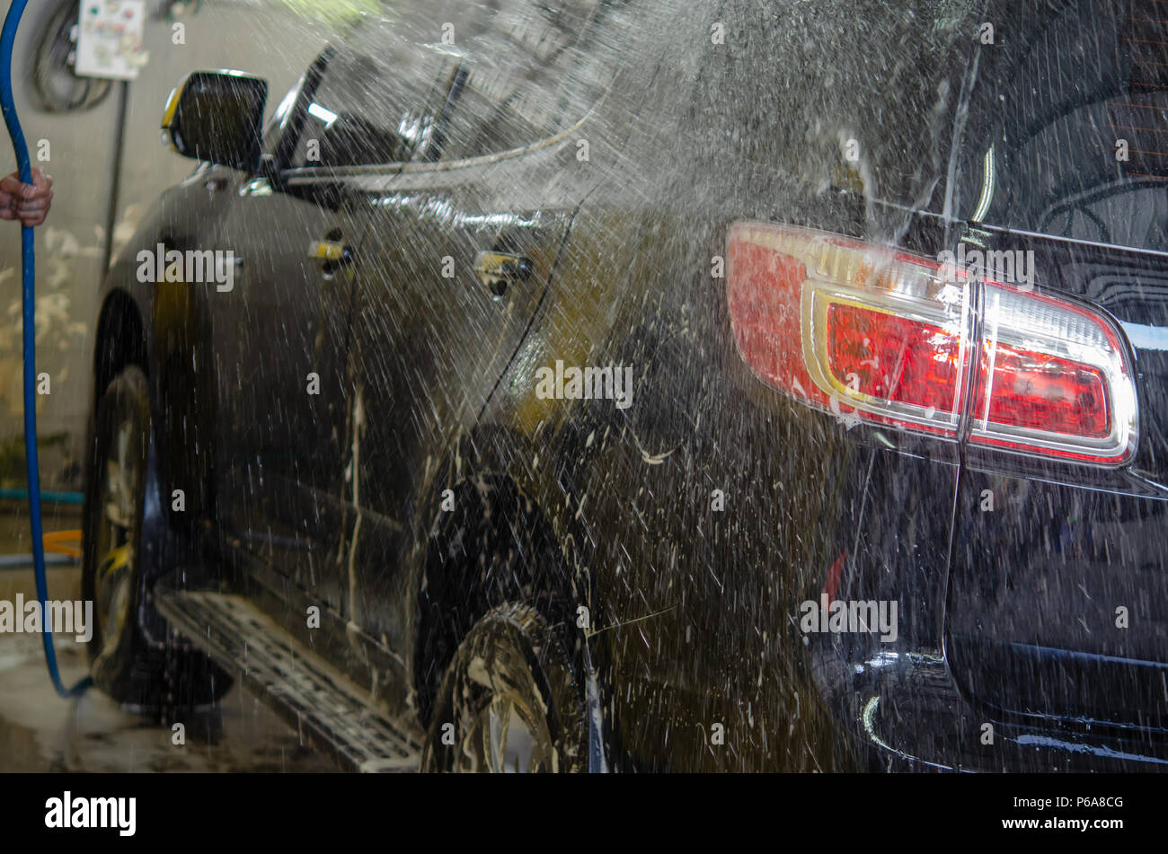 Car wash with foam in car wash Stock Photo Alamy