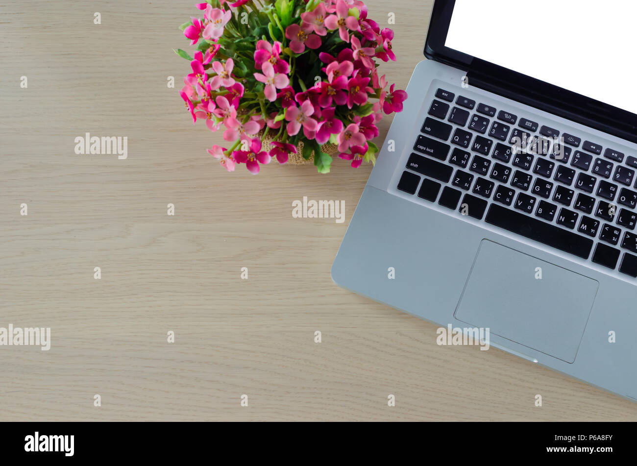 laptop blank screen on wooden table Stock Photo