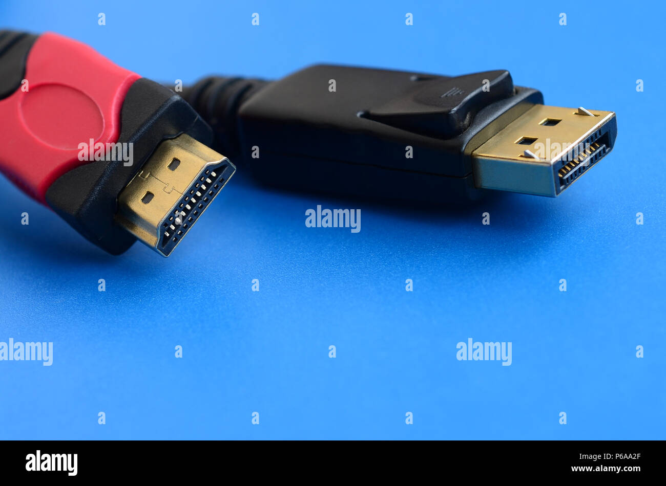 Audio video HDMI computer cable plug and 20-pin male DisplayPort gold  plated connector for a flawless connection on a blue background Stock Photo  - Alamy