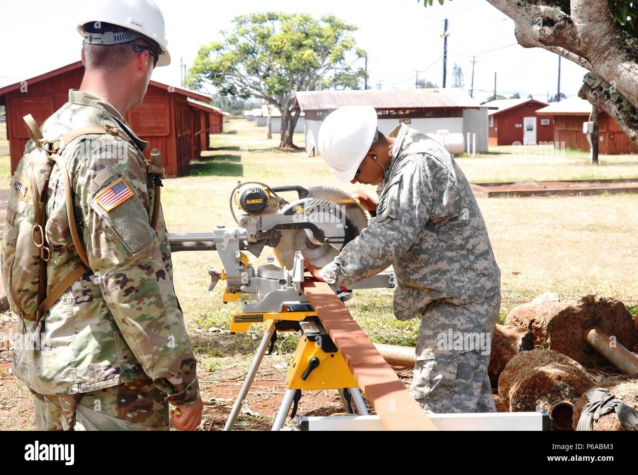 Spc. Cesar Plaza (right), interior electrician, and Spc. Christopher