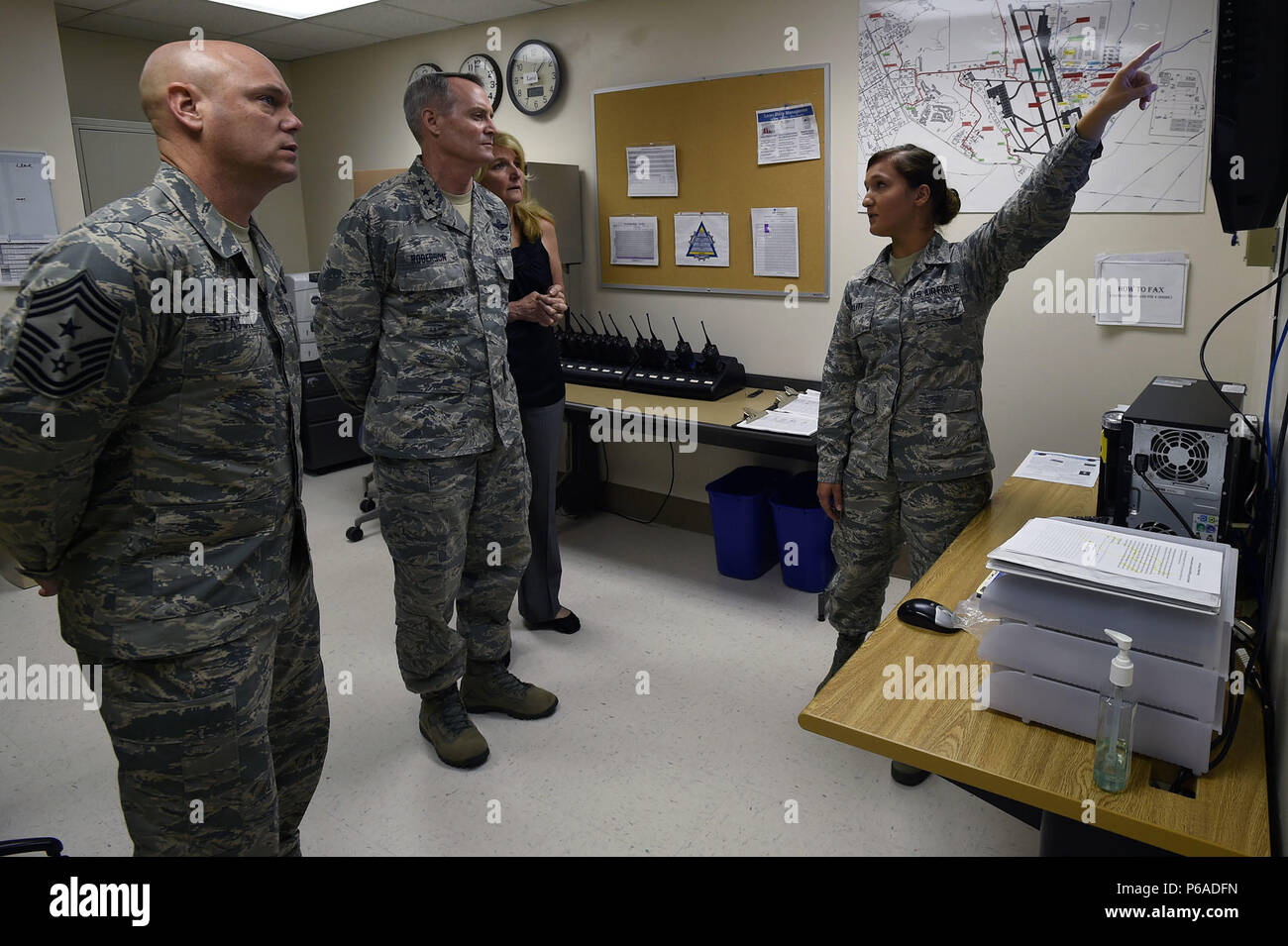 Senior Airman Arlinda Haliti briefs Lt. Gen. Darryl Roberson, commander, Air Education and Training Command, his wife, Cheryl Roberson, and AETC Command Chief Master Sgt. David Staton, on the En-Route Patient Staging System facility and mission May 11 at the Wilford Hall Ambulatory Surgical Center, Joint Base San Antonio-Lackland. Roberson and Staton visited the WHASC May11, meeting with 59th Medical Wing senior leaders and Airmen to learn more about the wing’s mission of developing warrior medics through patient-centered health care and continuous improvement. Haliti is an aerospace medical t Stock Photo