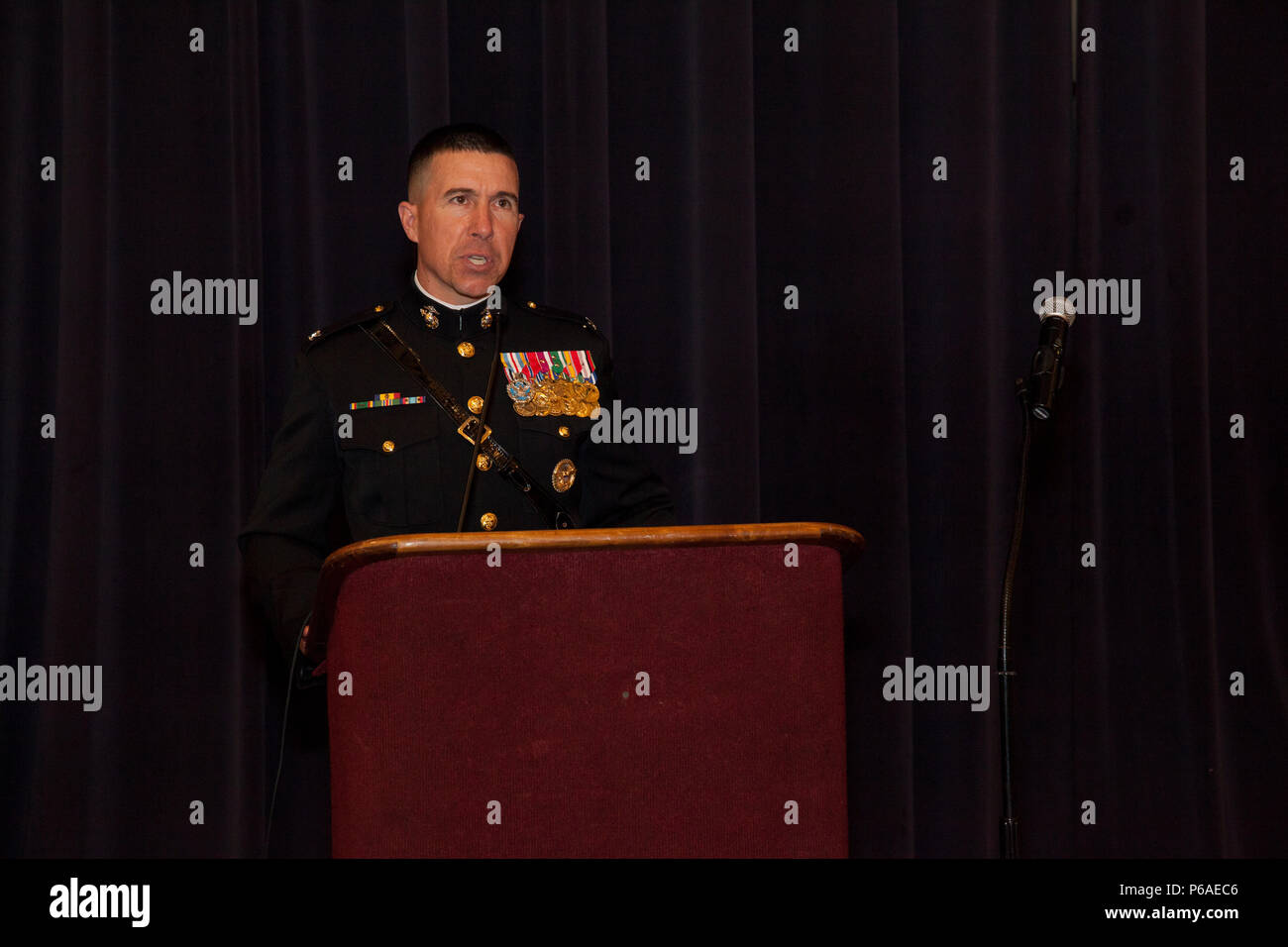 U.S. Marine Corps Col. Benjamin T. Watson, commanding officer of Marine Barracks Washington (MBW), speaks during a recpetion of an Evening Parade at Crowder Hall, MBW, Washington, D.C., April 29, 2016. The guest of honor was Gen. Robert B. Neller, the 37th commandant of the Marine Corps, and Watson was the Hosting Official. The evening parade summer tradition began in 1934 and features the Silent Drill Platoon, the U.S. Marine Band, the U.S. Marine Drum and Bugle Corps and two marching companies. More than 3,500 guests attend the parade every week. (U.S. Marine Corps photo by Lance Cpl. Hailey Stock Photo