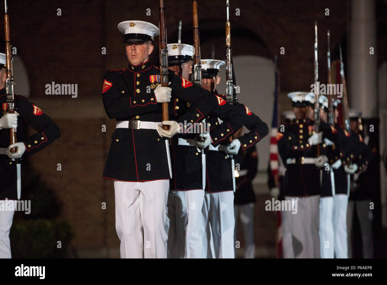 Members of the Silent Drill Platoon with Marine Barracks Washington (MBW) perform during an evening parade at MBW, Washington, D.C., April. 29, 2016. The guest of honor was Gen. Robert B. Neller, the 37th commandant of the Marine Corps, and the hosting official was Col. Benjamin T. Watson, commanding officer, Marines Barracks Washington. The evening parade summer tradition began in 1934 and features the Silent Drill Platoon, the U.S. Marine Band, the U.S. Marine Drum and Bugle Corps and two marching companies. More than 3,500 guests attend the parade every week. (U.S. Marine Corps photo by Lan Stock Photo