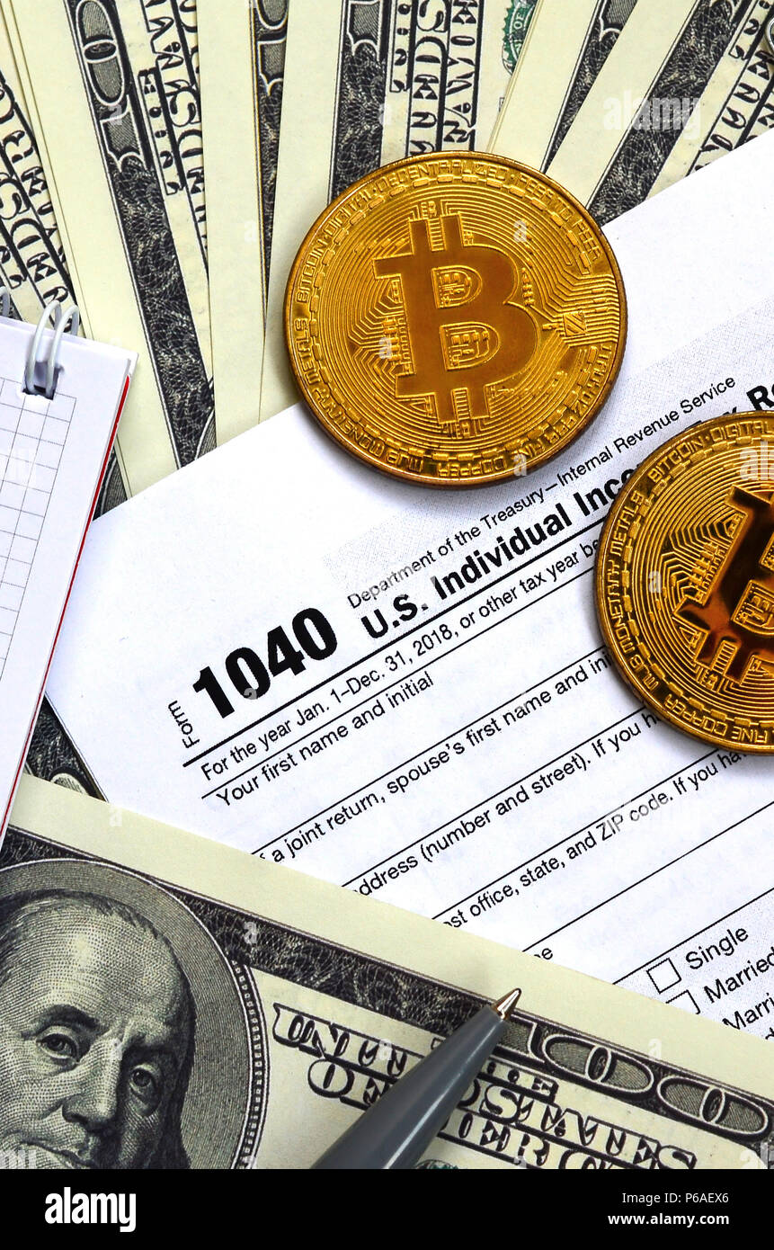 The pen, bitcoins and dollar bills is lies on the tax form 1040 U.S.  Individual Income Tax Return. The time to pay taxes Stock Photo - Alamy