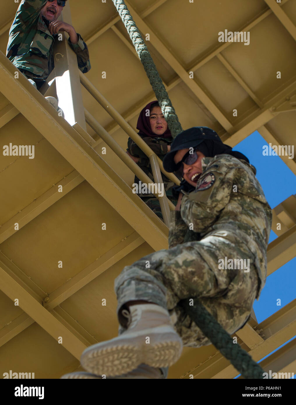 A Ktah Khas Afghan Female Tactical Platoon member participates in a fast roping training drill outside Kabul, Afghanistan May 29, 2016. The females work closely alongside the males on operations to engage and interact with women and children. The FTPs are trained in marksmanship, language, fast roping and other combat-related skills. (U.S. Air Force photo by Staff Sgt. Douglas Ellis/Released) Stock Photo