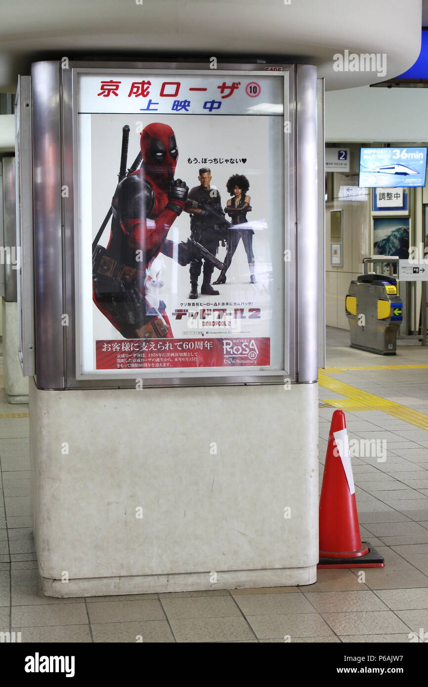 View of inside of Chiba City Keisei line train station which includes a pillar with an advert for the movie Deadpool 2. (6/2018) Stock Photo