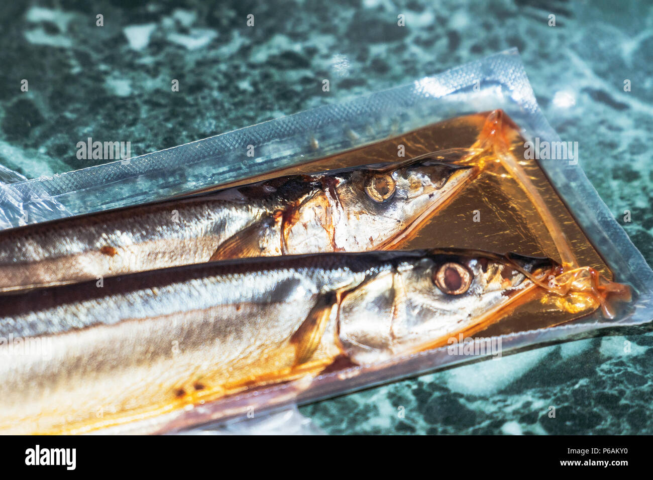 Sea fish saury in vacuum packaging Stock Photo Alamy