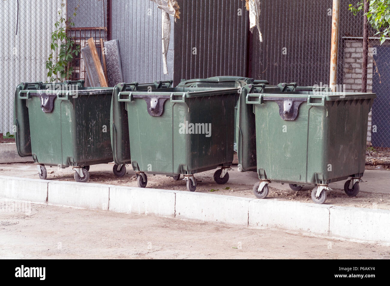 Three plastic garbage cans Stock Photo Alamy