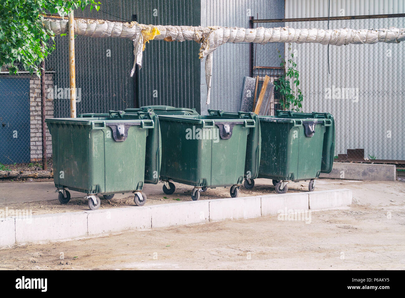 Three plastic garbage cans Stock Photo Alamy