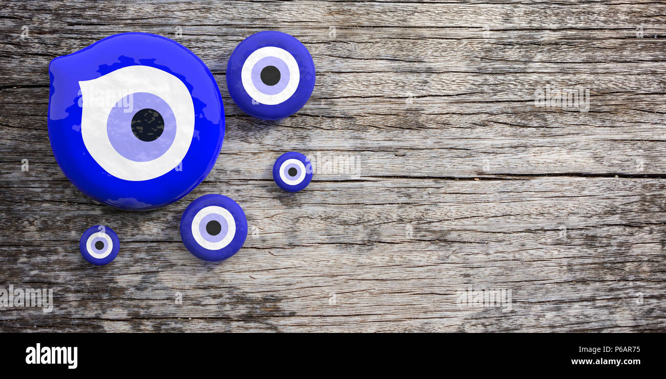 Evil turkish eye amulet, in miscellaneous sizes, protection from bad luck with copy space on wooden background. 3d illustration Stock Photo