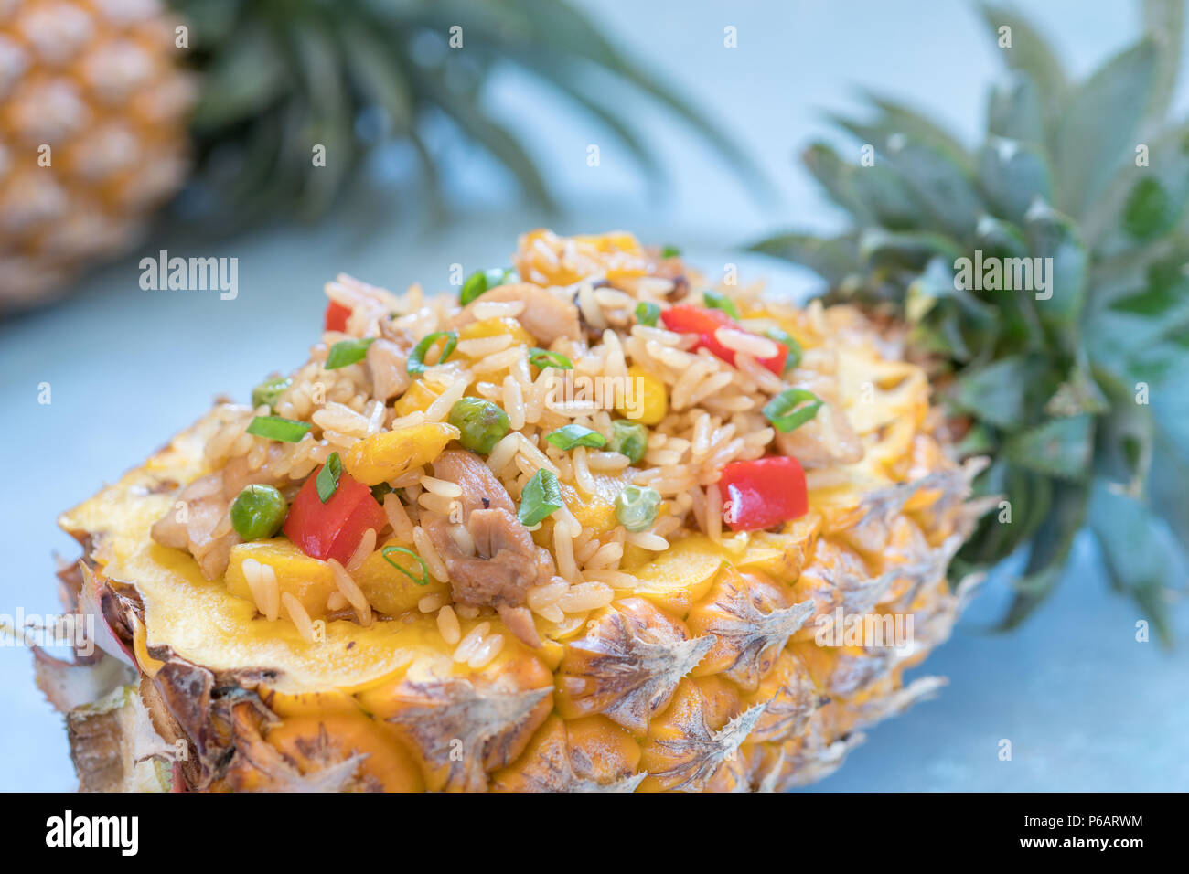 Thai pineapple stuffed with fried rice, chicken and vegetables Stock