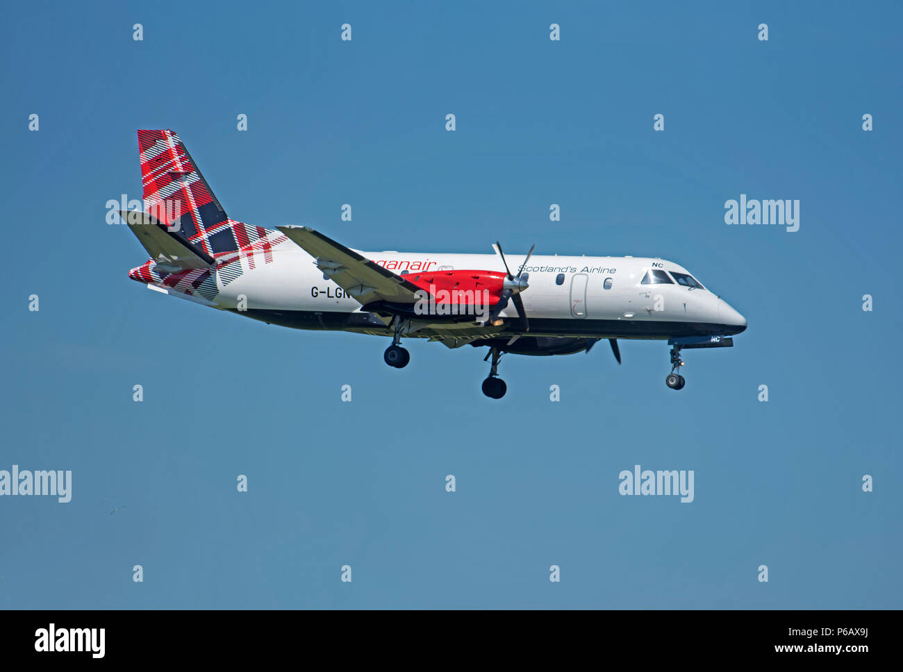 Loganair Saab 340 G-LGNC taking off from Inverness Airport on it's daily flight to Stornoway in the Outer Hebrides. Stock Photo