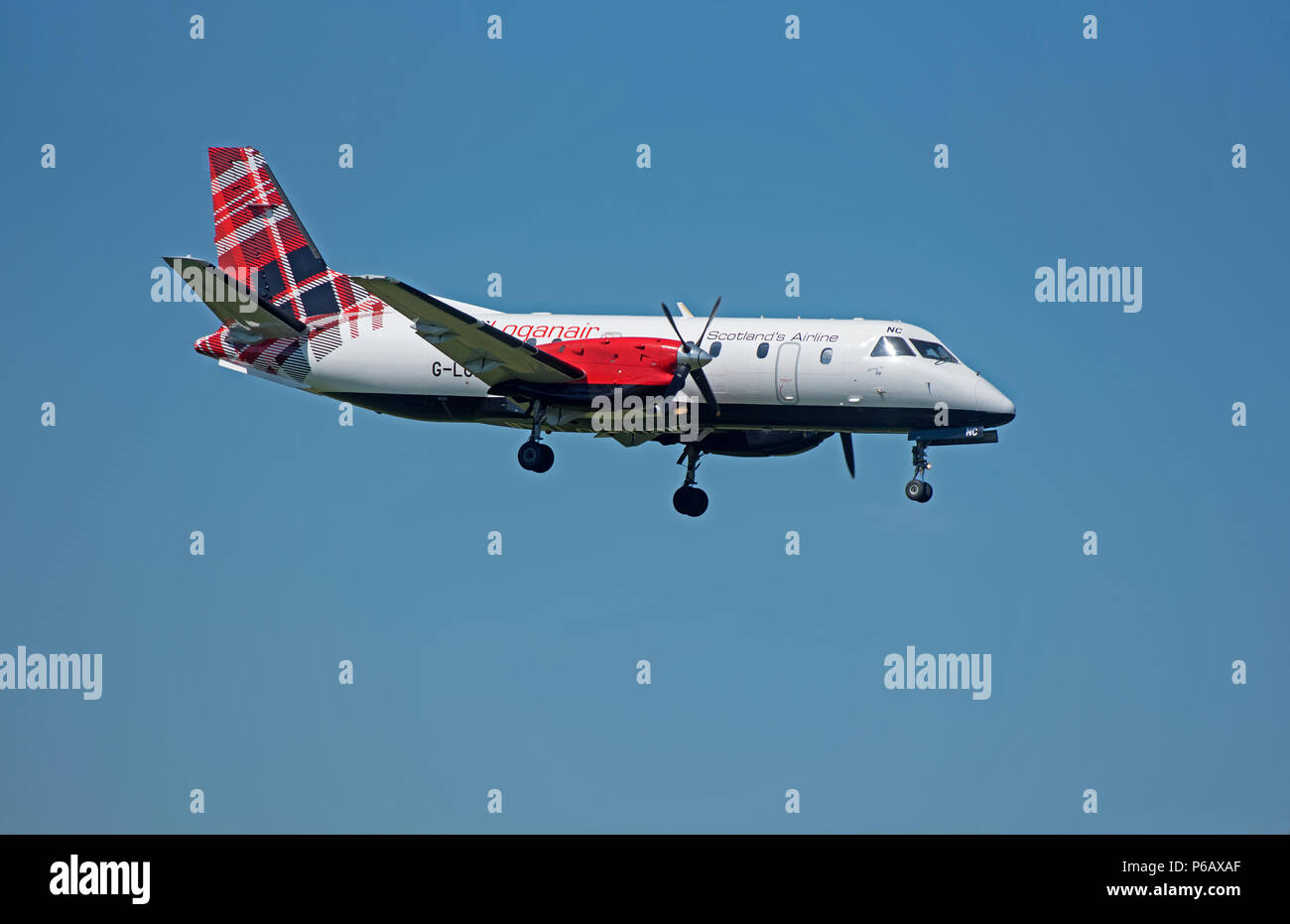 Loganair Saab 340 G-LGNC taking off from Inverness Airport on it's daily flight to Stornoway in the Outer Hebrides. Stock Photo