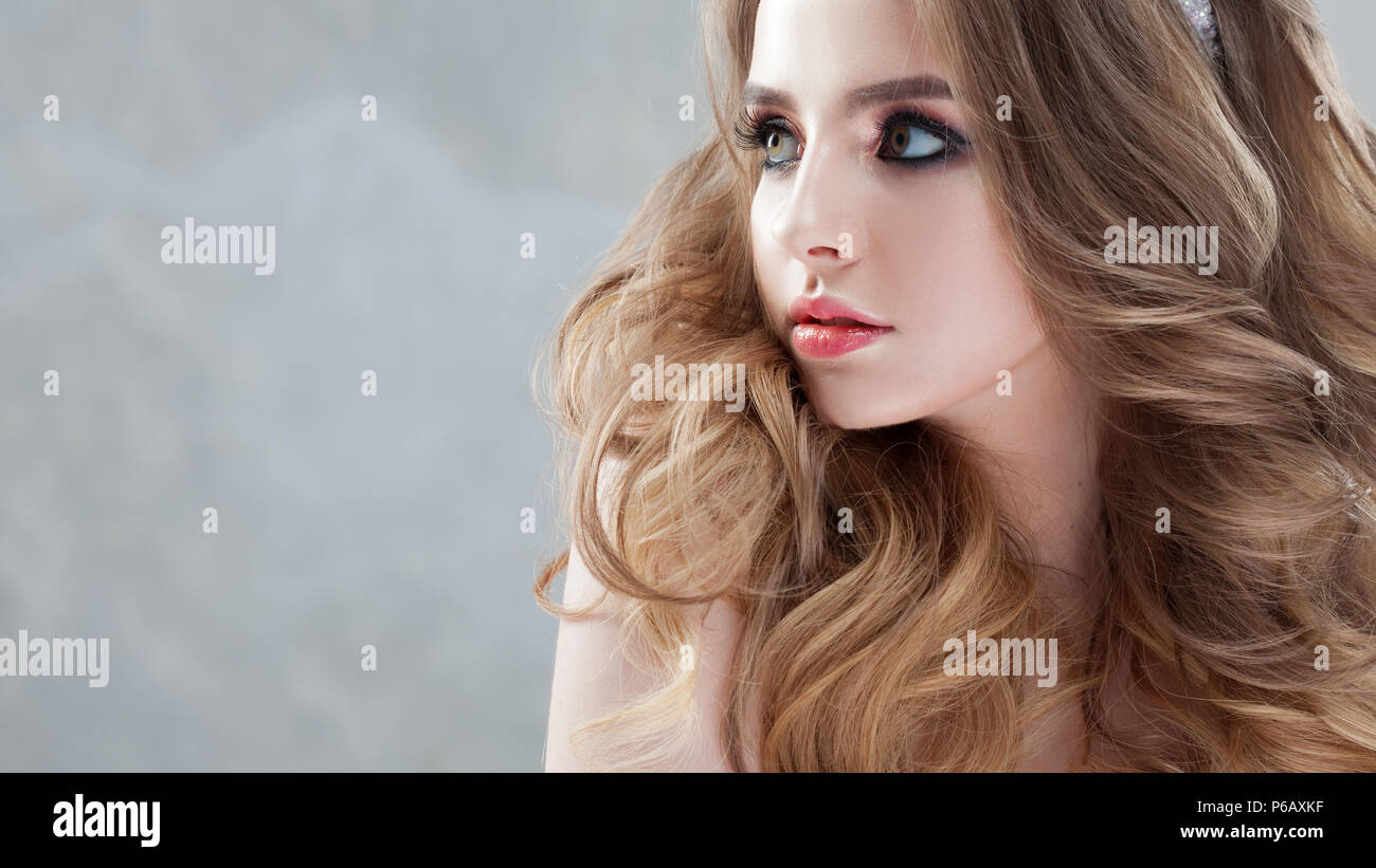 Young Charming Bride In Wedding Dress Make Up And Hairstyle With