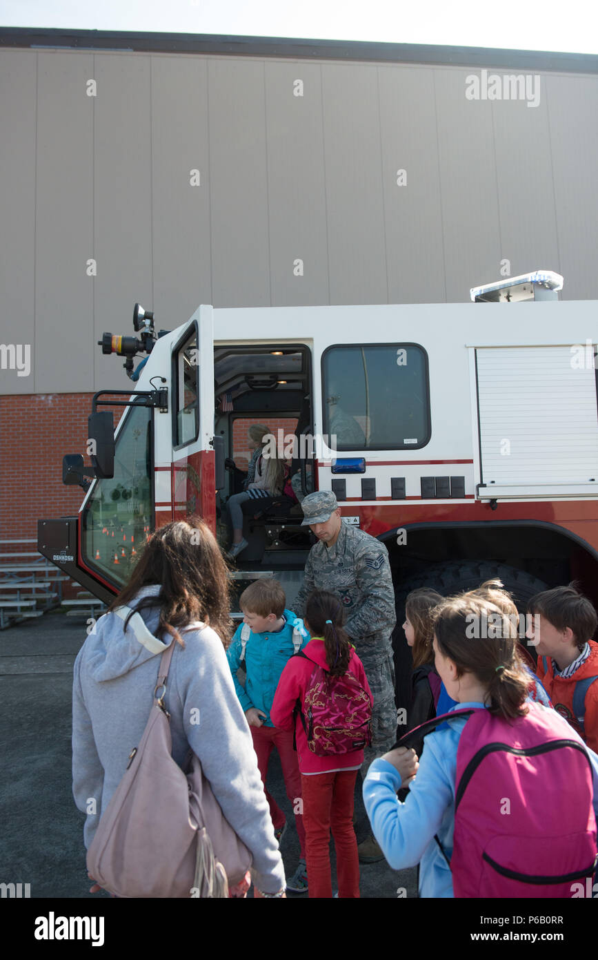 Belgian schoolchilds from the Lens elementary school get to climb aboard a U.S. Air Force fire truck during United States Army Garrison Benelux safety day, on Chièvres Air Base, Chièvres, Belgium, May 26, 2016. (U.S. Army photo by Visual Information Specialist Pierre-Etienne Courtejoie/Released) Stock Photo