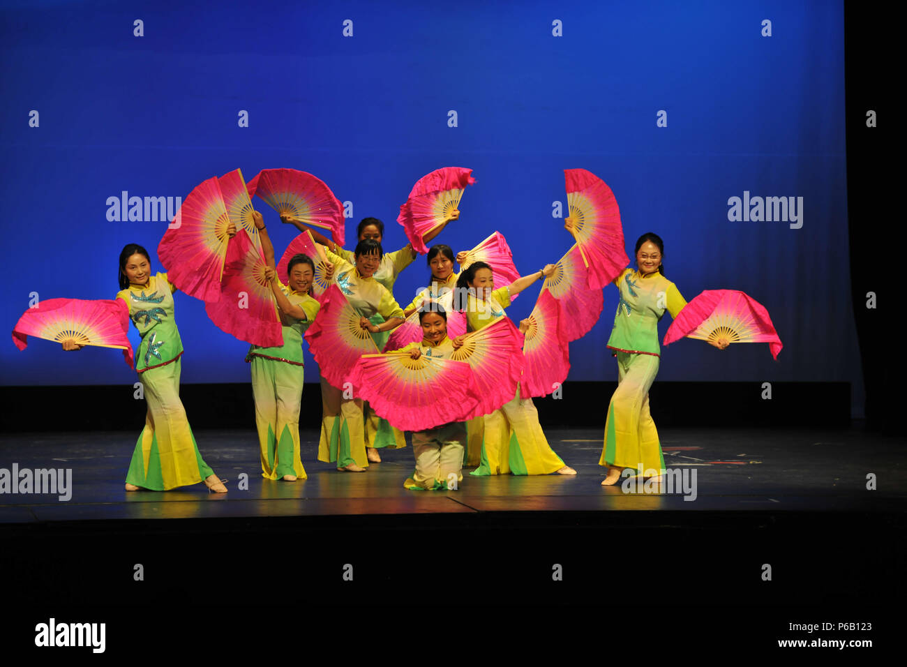 Defense Language Institute Foreign Language Center Mandarin Chinese instructors perform a dance during the 41st Annual Mandarin Speech Contest in San Francisco April 23, though they did not judge their own students. Service members studying Mandarin Chinese participated with 36 DLIFLC students winning awards. Stock Photo
