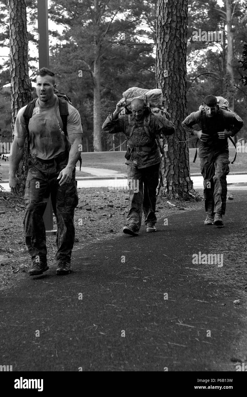 Airmen from the 4th Security Forces Squadron complete a two-mile ruck ...