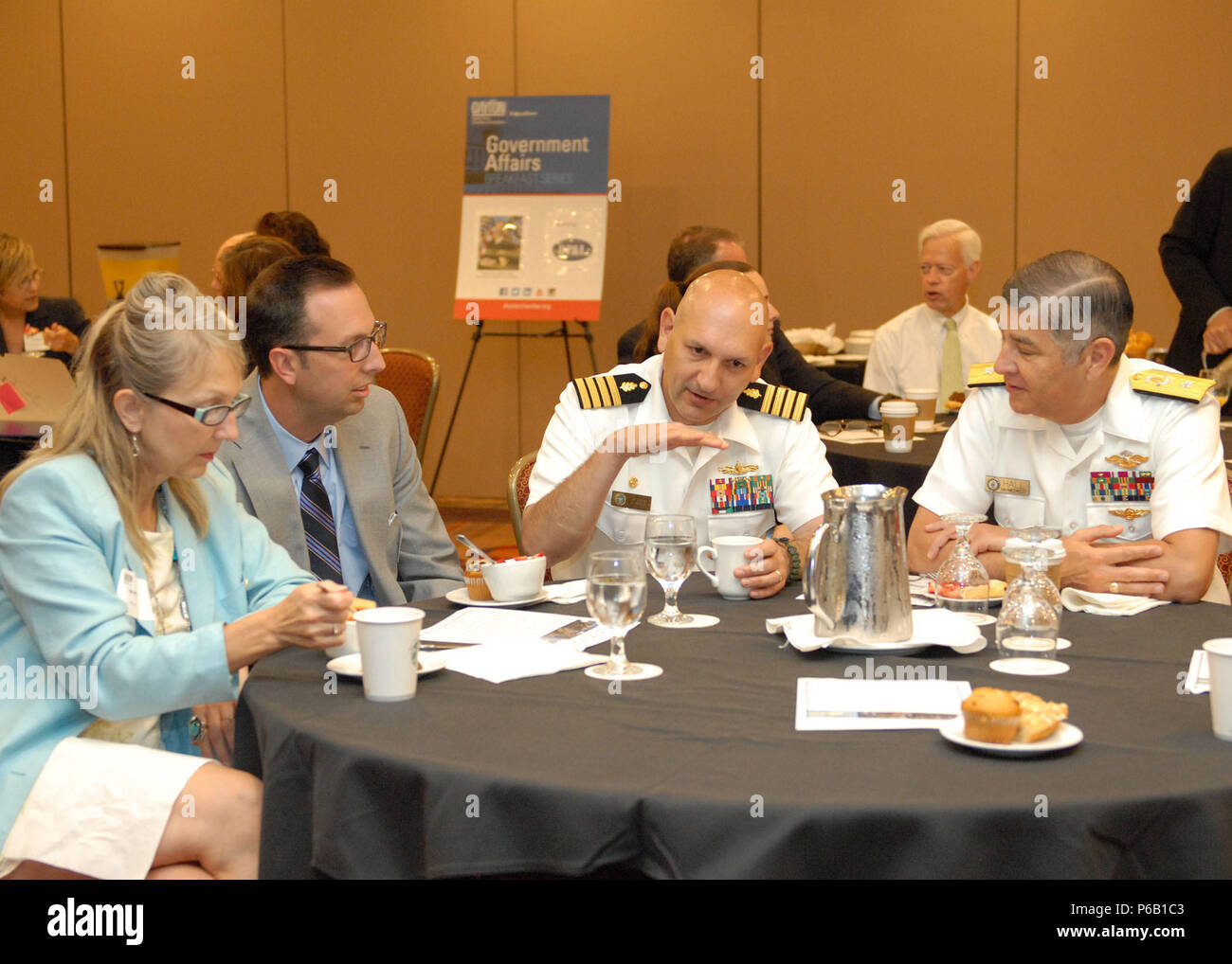 160614-N-QH078-035 DAYTON, Ohio (June 14, 2016) Capt. Rees L. Lee, Naval Medical Research Unit-Dayton Commanding Officer, and Rear Adm. Victor W. Hall, Navy Medicine West Deputy Commander, Deputy Corps Chief for Medical Service Corps, talks with members of the Dayton Area Chamber of Commerce June 14, during Navy Week Dayton, Ohio. Navy weeks are events held throughout the United States to help raise public awareness of the U.S. Navy in areas that are not typically exposed to a large naval presence. (U.S. Navy photo by Mass Communication Specialist 2nd Class (SW/AW) Dominique J. Shelton/Release Stock Photo