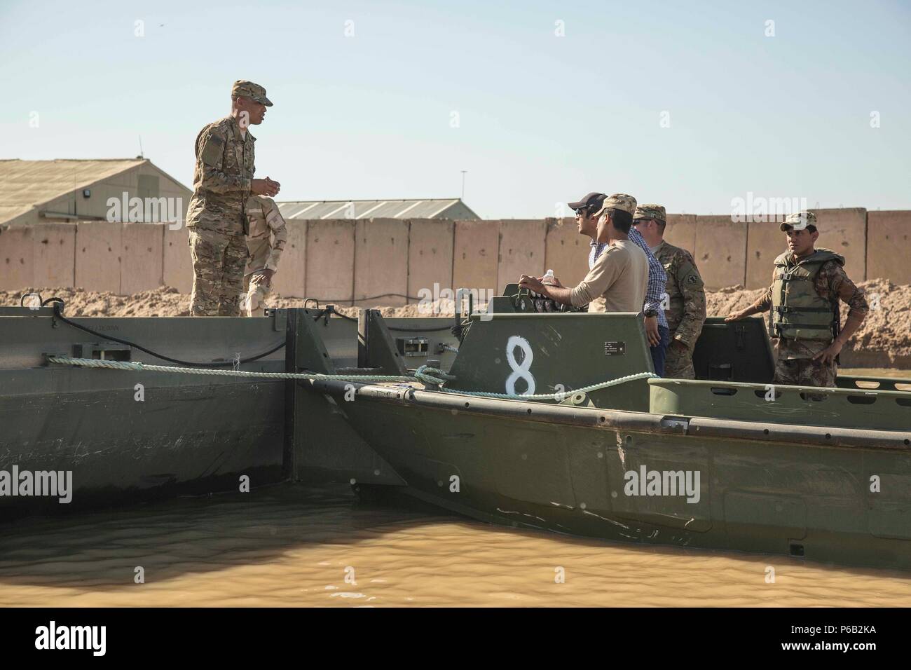 U.S. Army Sgt. Terray Whitehurst, left, an engineer assigned to the