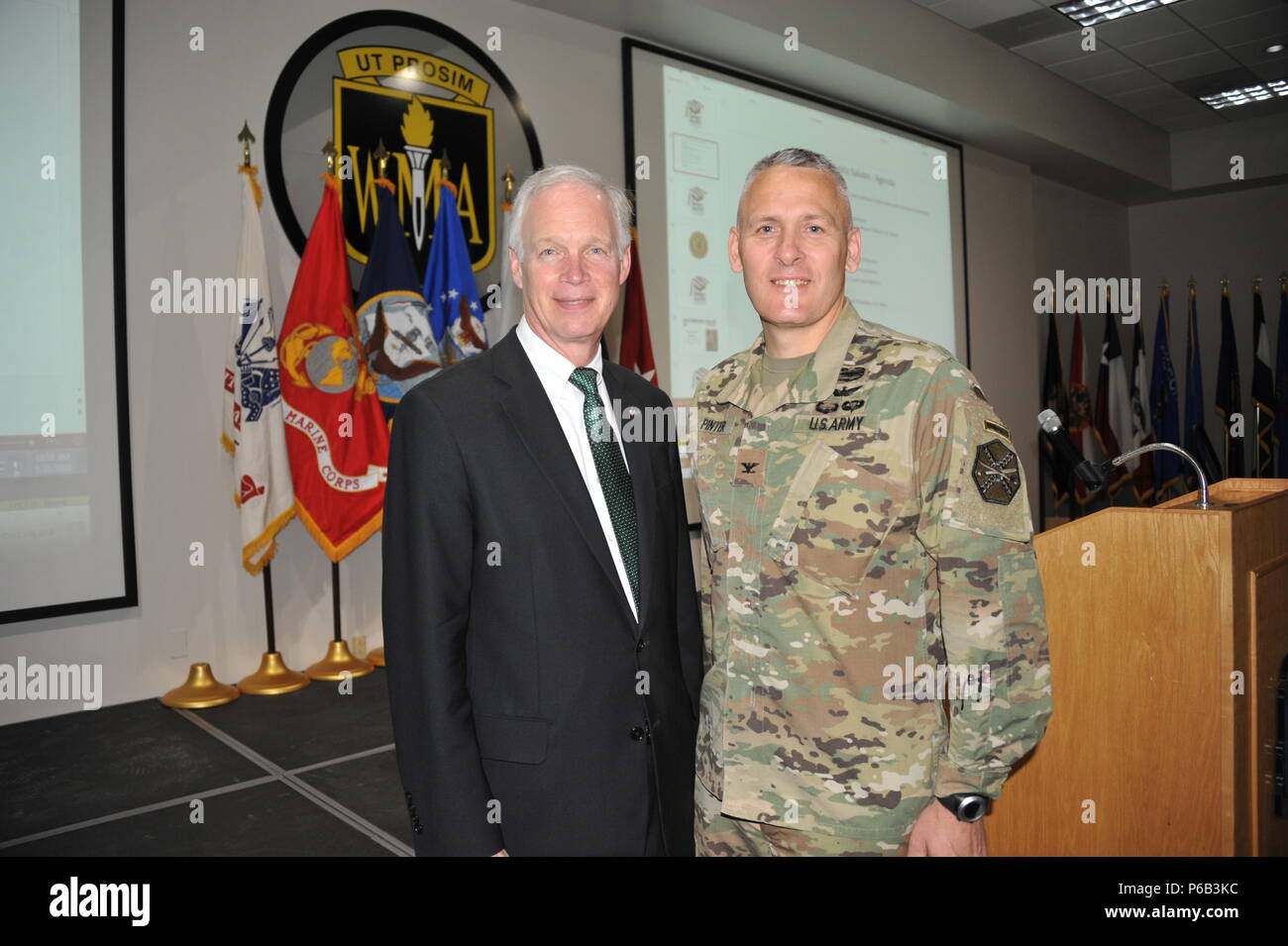 U.S. Senator Ron Johnson of Wisconsin (left) and U.S. Army Col. David Pinter pose for a photo before a ceremony honoring high school seniors who have committed to elist in the armed forces at Fort McCoy, Wis. May 21, 2016.  The event entitled 'Our Community Salutes' was held at the Wisconsin Military Academy and recognized nearly 50 youth representing all five branches of the U.S. military.  U.S. Army photo by Jamal Wilson Stock Photo