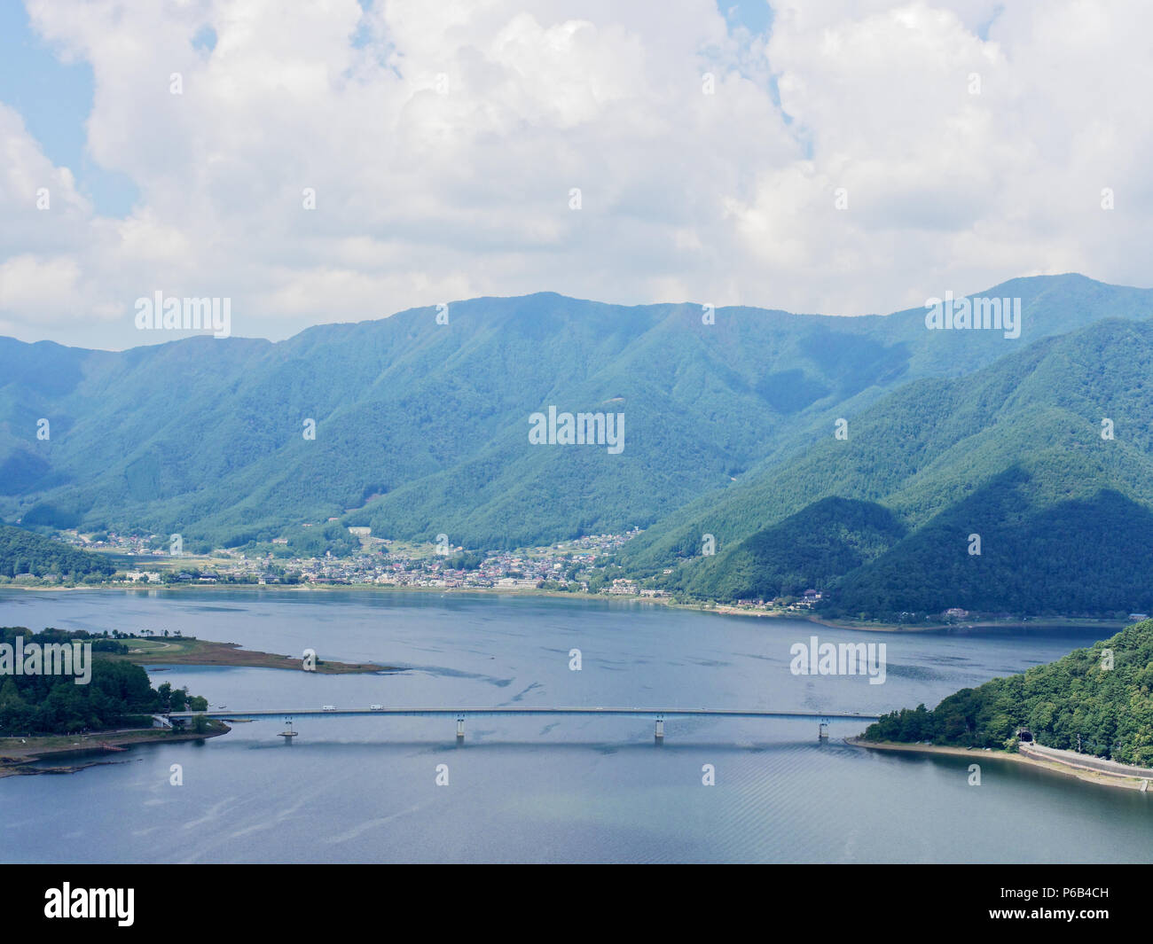 Scenery of Lake Kawaguchi, the biggest lake of Fuji five lakes, with an overwater bridge crossing the lake and mt Kurodake on the background, famous tourist destination in Japan Stock Photo