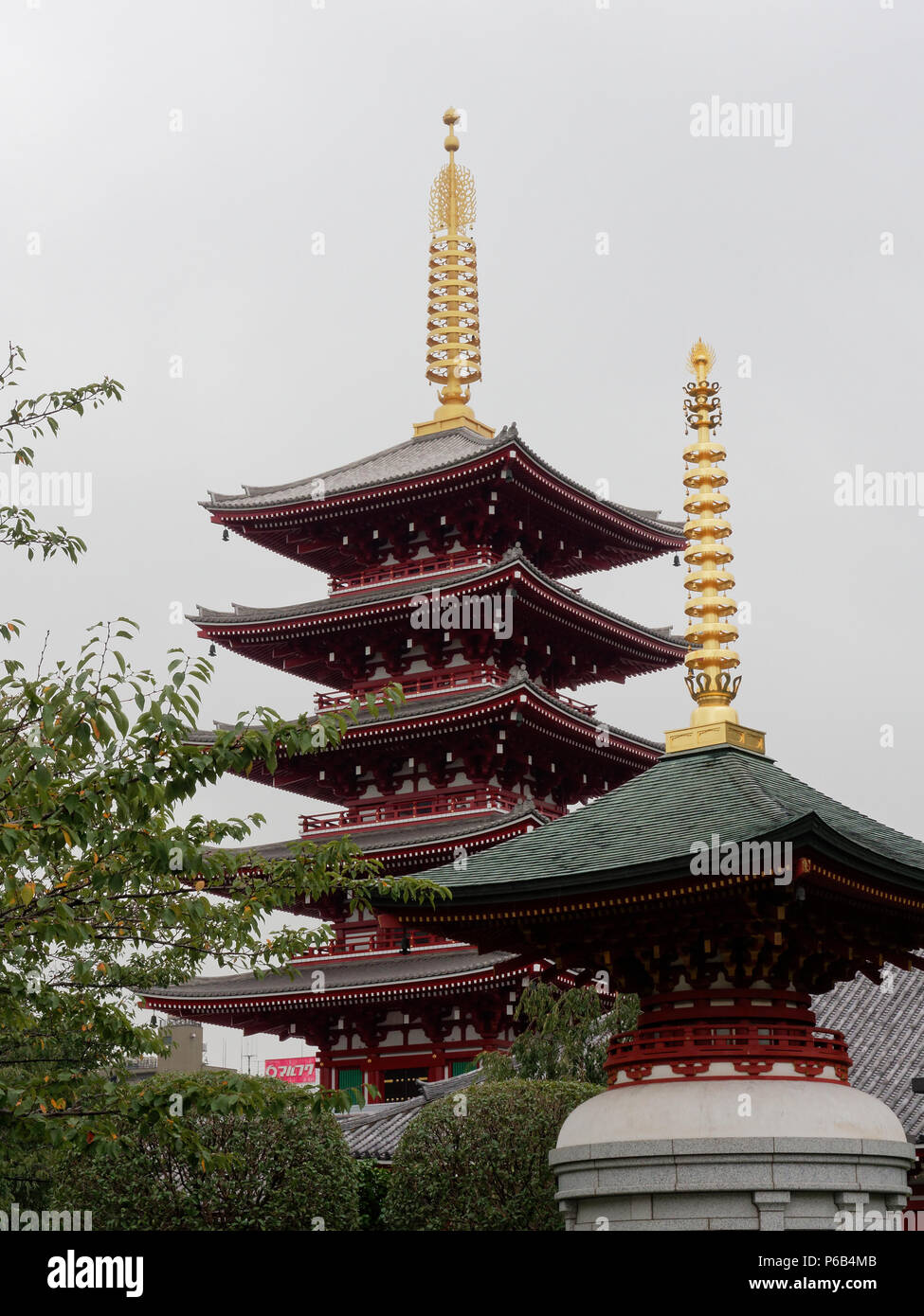 TOKYO, JAPAN - SEPTEMBER 28, 2017: 5 storied pagoda, one of the famous tourist destination in Senso-ji temple, over sky background with a small pagoda in the foreground Stock Photo