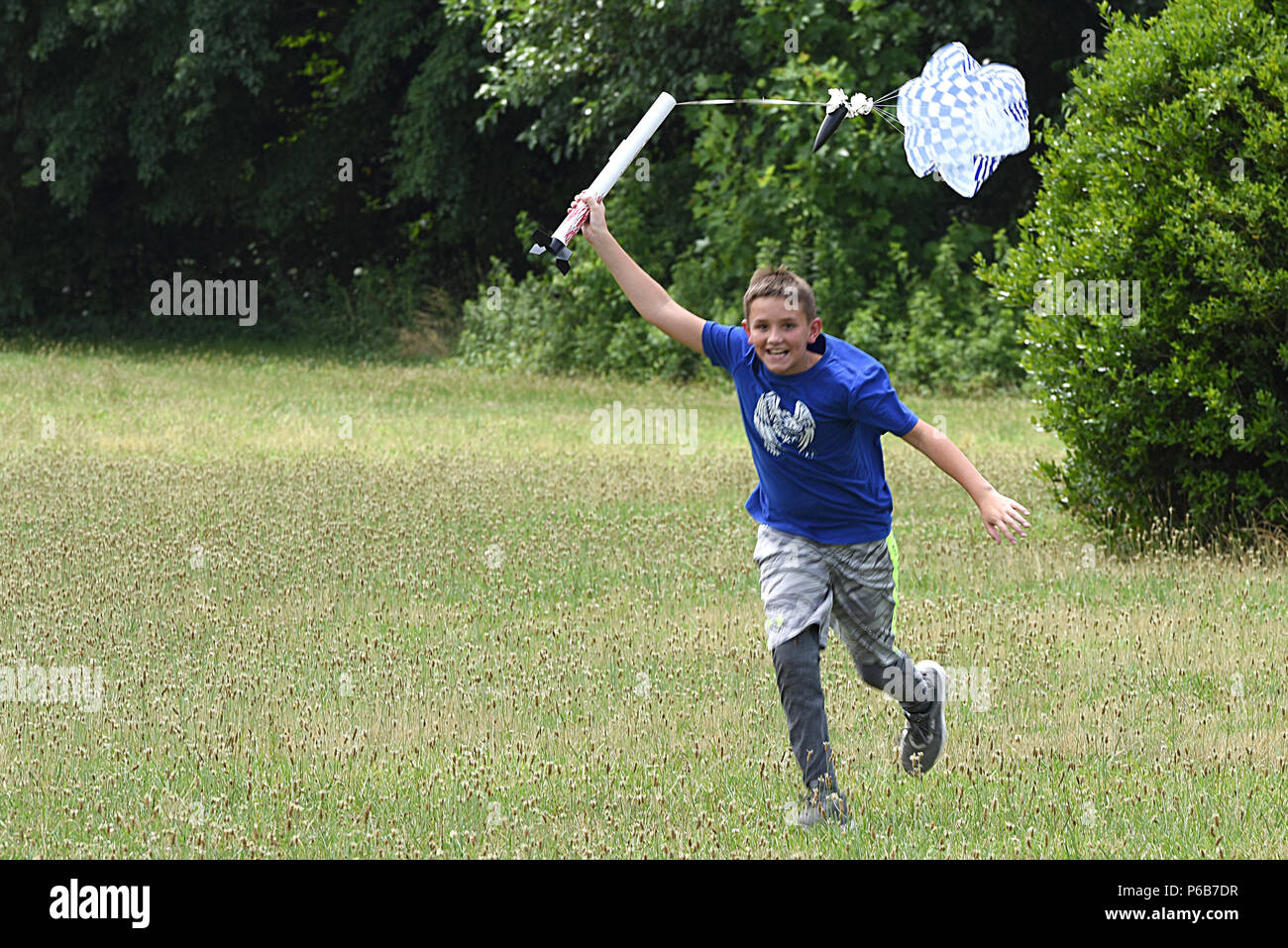 Louis Helms, son of U.S. Air Force Major Jeannie Helms, 145th Comptroller Flight commander, launches and catches his model rocket near Reid Park Academy Charlotte, N.C., June 21, 2018. Helms, along with other campers and teachers are part of the annual Department of Defense STARBASE summer camp program with the North Carolina Air National Guard and they learn various applications of science, technology, engineering, and math. Stock Photo