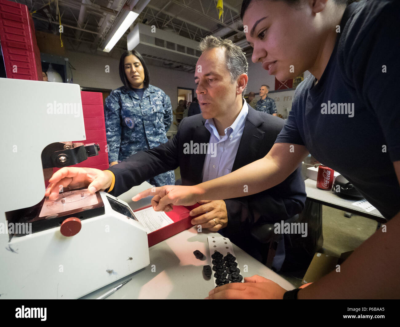 Kentucky Gov. Matt Bevin (center) prepares lens blanks for prescription  eyeglasses with help from . Navy HN Leticia Hernandez (left) and HN  Desiree Robles, opticians from the . Navy's Mobile Optical Support