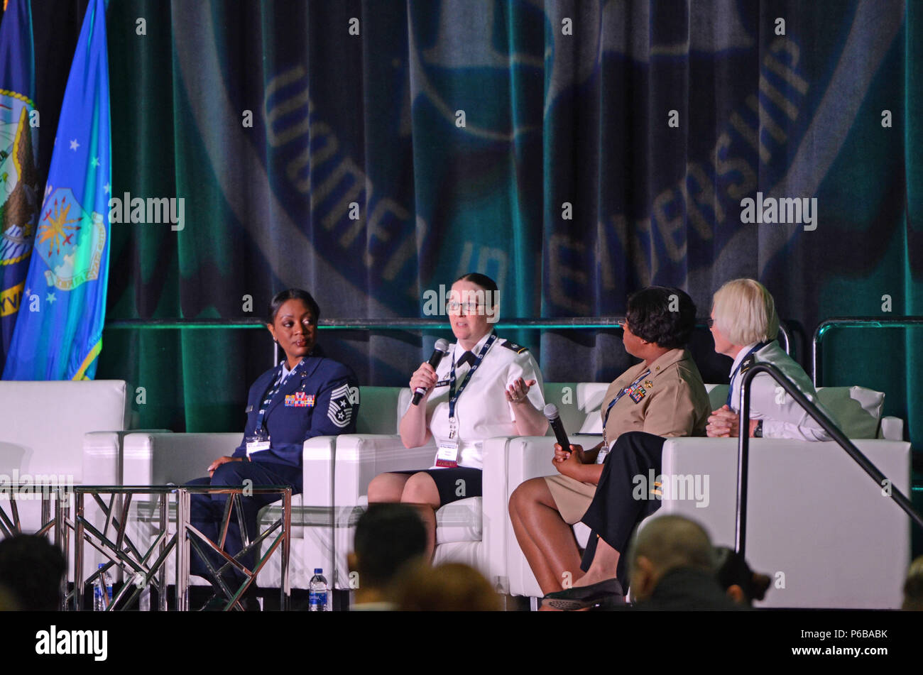 From left: US Air Force Chief Master Sgt. Diena Mosley, Command Chief 30th Space Wing, US Army Lt. Col. Katrina Walters, Deputy Chief of Clinical Services Weed Army Community Hospital, US Navy Cmdr. Elizabeth Reeves, Preventive Medicine Officer, 1 Marine Expeditionary Force, US Army Brig. Gen. Jill K Faris, Assistant Surgeon General for Mobilization, Readiness and National Guard Affairs sat on the women's health panel to discuss their expert practices in preventive, acute, and chronic healthcare for military women during the Joint Women Leadership Symposium June 20. Stock Photo
