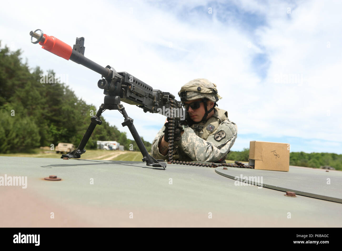 Sgt. Duane McDonald, a wheeled vehicle operator and Westerville, Ohio native with the 1487th Motor Transportation Company, observes his sector of fire to defend his unit June 22 at the Camp Grayling Joint Maneuver Training Center in Grayling, Mich. Many Ohio National Guard units are conducting Annual Training which builds on knowledge and skills and increases the Army's ability to deploy for combat operations more quickly. (Ohio Army National Guard photo by Sgt. Joanna Bradshaw/Released) Stock Photo