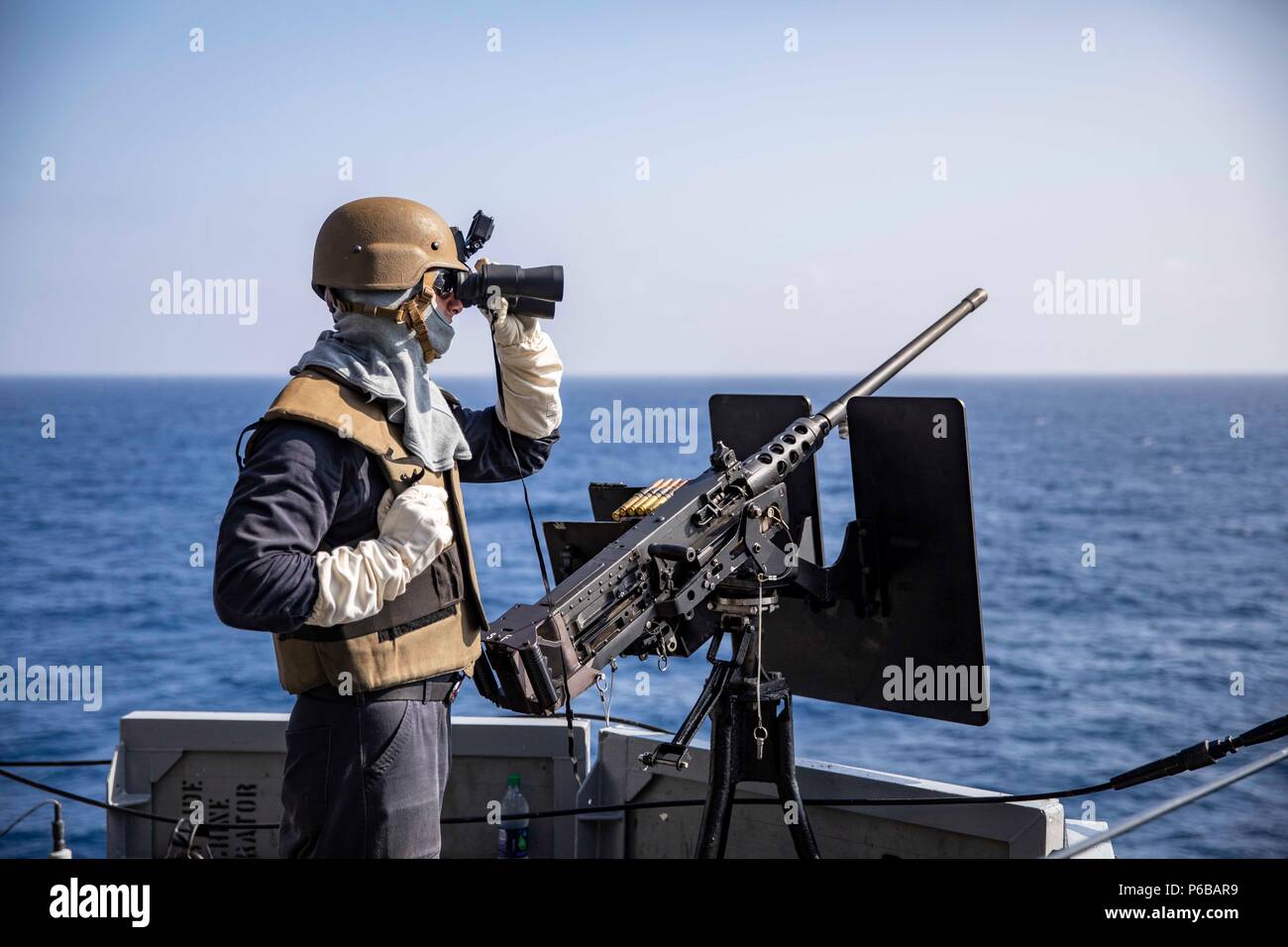 180623-N-KW492-0021 ATLANTIC OCEAN (June 23, 2018) Aviation Ordnanceman 3rd Class Alex Blanco scans for surface contacts during an integrated live-fire weapons exercise aboard the Wasp-class amphibious assault ship USS Kearsarge (LHD 3) as part of Surface Warfare Advanced Tactical Training (SWATT). The Kearsarge Amphibious Ready Group is completing the Navy’s first East Coast SWATT exercise. SWATT is led by the Naval Surface and Mine Warfighting Development Center and is designed to increase warfighting proficiency, lethality, and interoperability of participating units. (U.S. Navy Photo by Ma Stock Photo