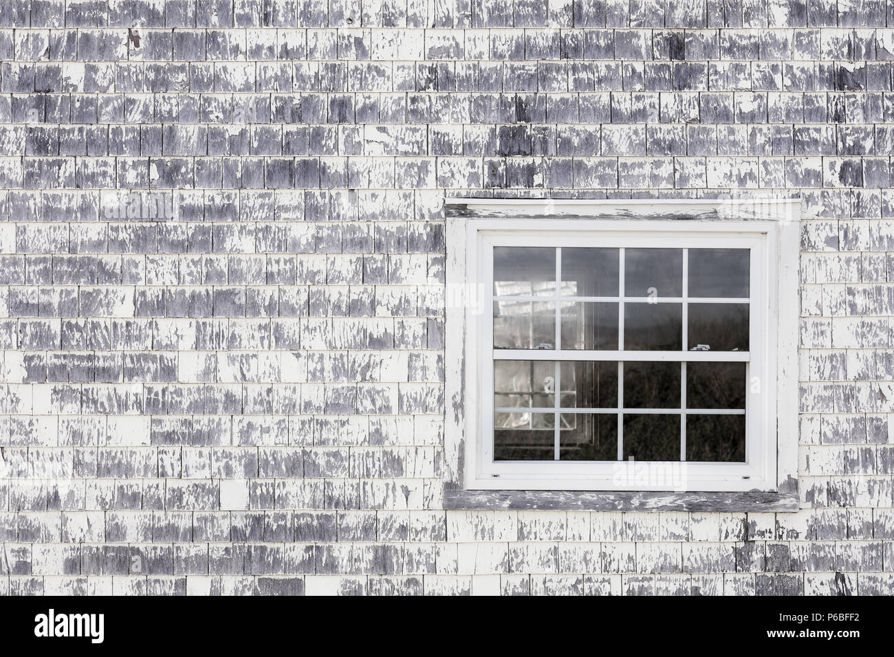 Old window, old wall and old shingles with peeling paint. Space for text. Stock Photo