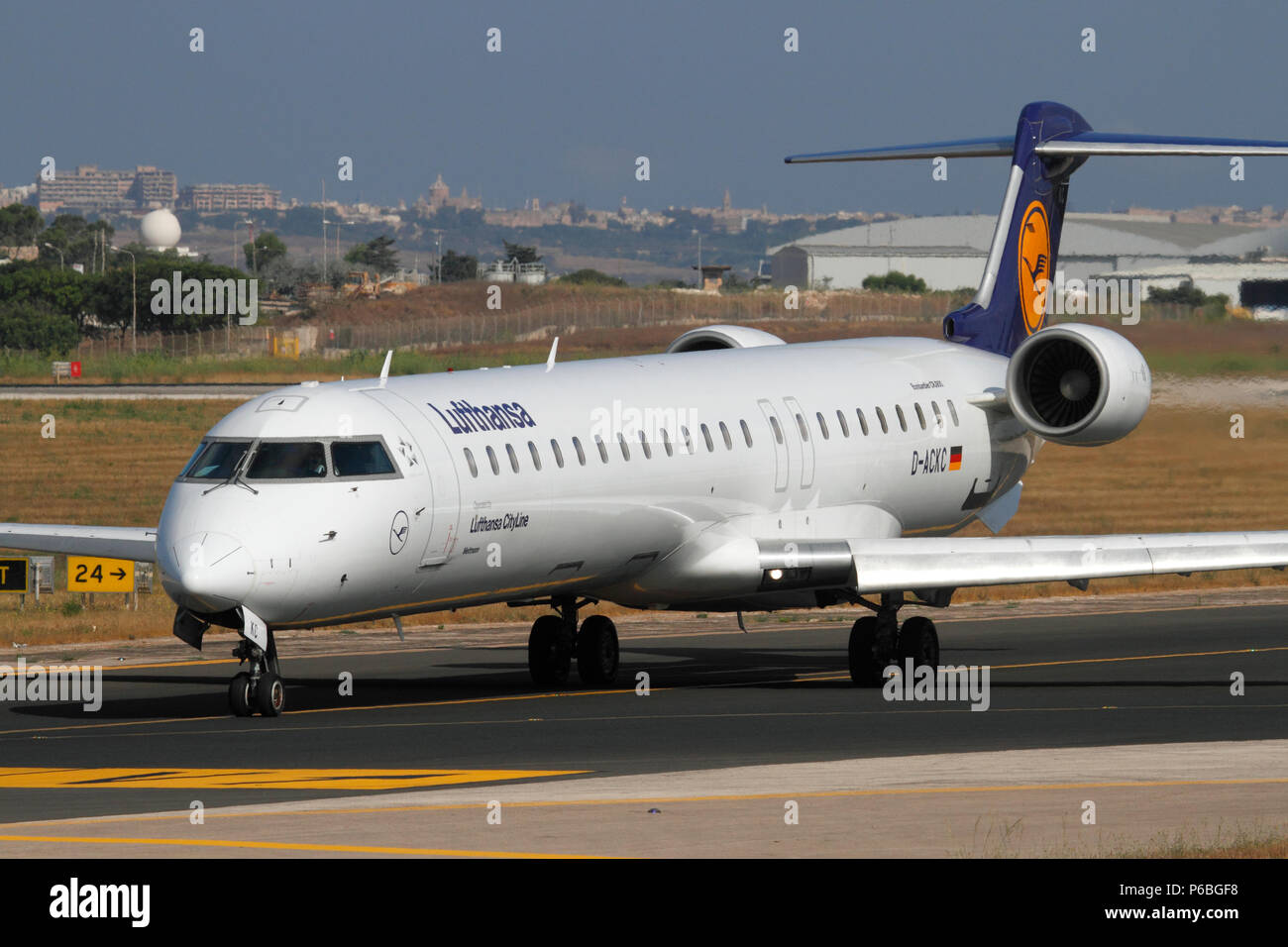 Lufthansa CityLine Bombardier CRJ900 short haul regional jet airliner taxiing for departure on a flight from Malta. Air travel and tourism in the EU. Stock Photo