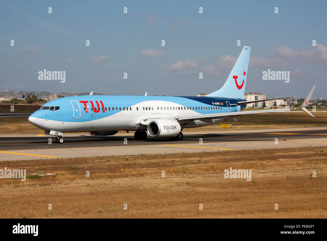 TUI Airways Boeing 737-800 (737NG or Next Generation) passenger jet plane taxiing on airport taxiway before departure from Malta. Modern aviation. Stock Photo