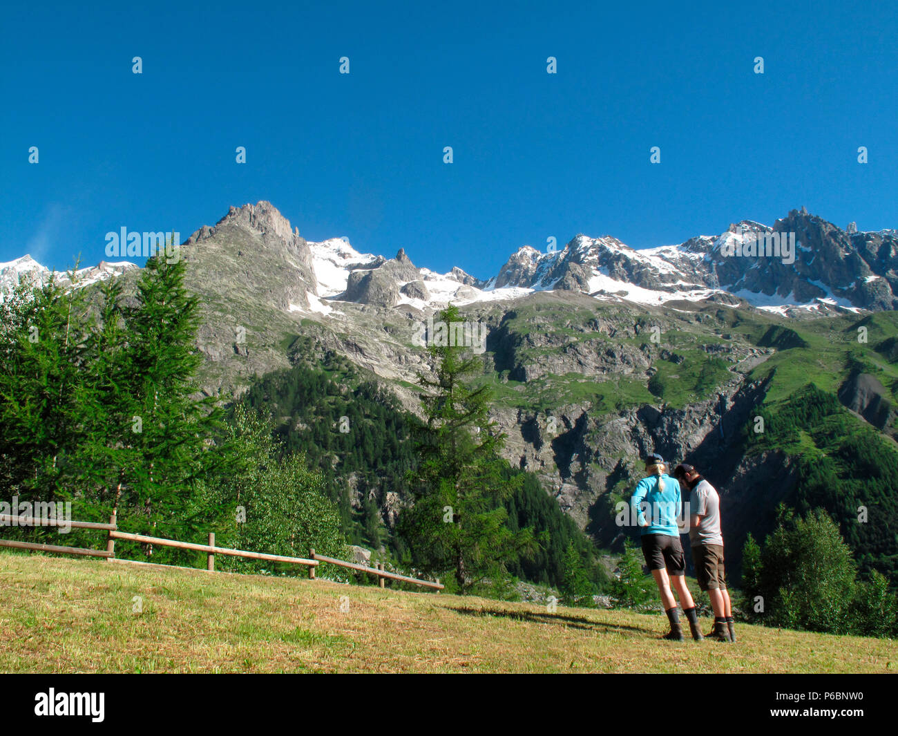 Italia,Aoste veny,Courmayeur, 2 hikers are standing in front of the ...