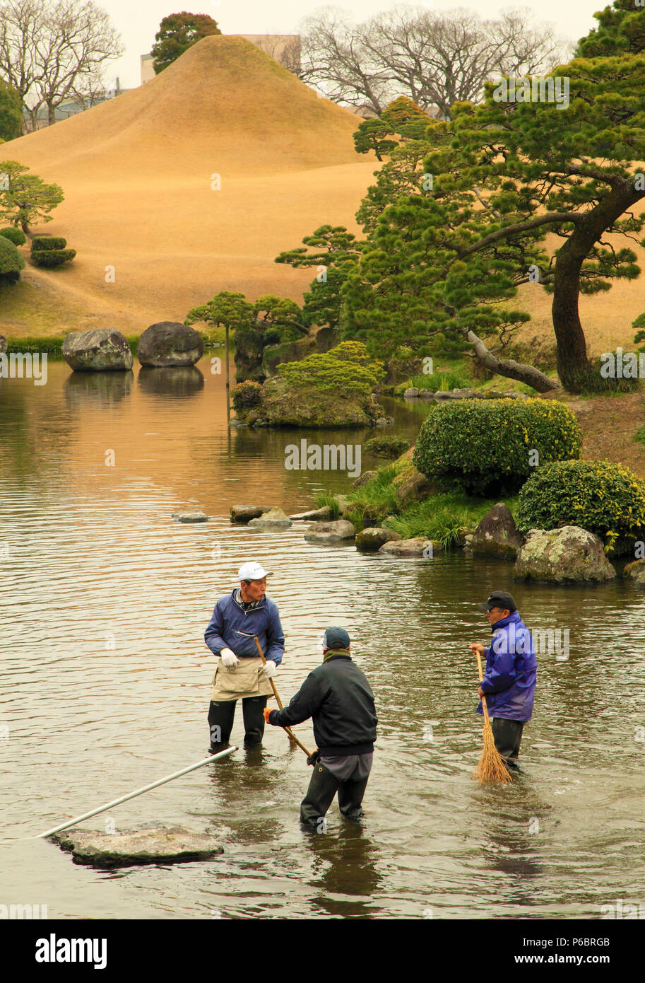 Japan, Kumamoto, Suizenji Garden, gardeners, Stock Photo