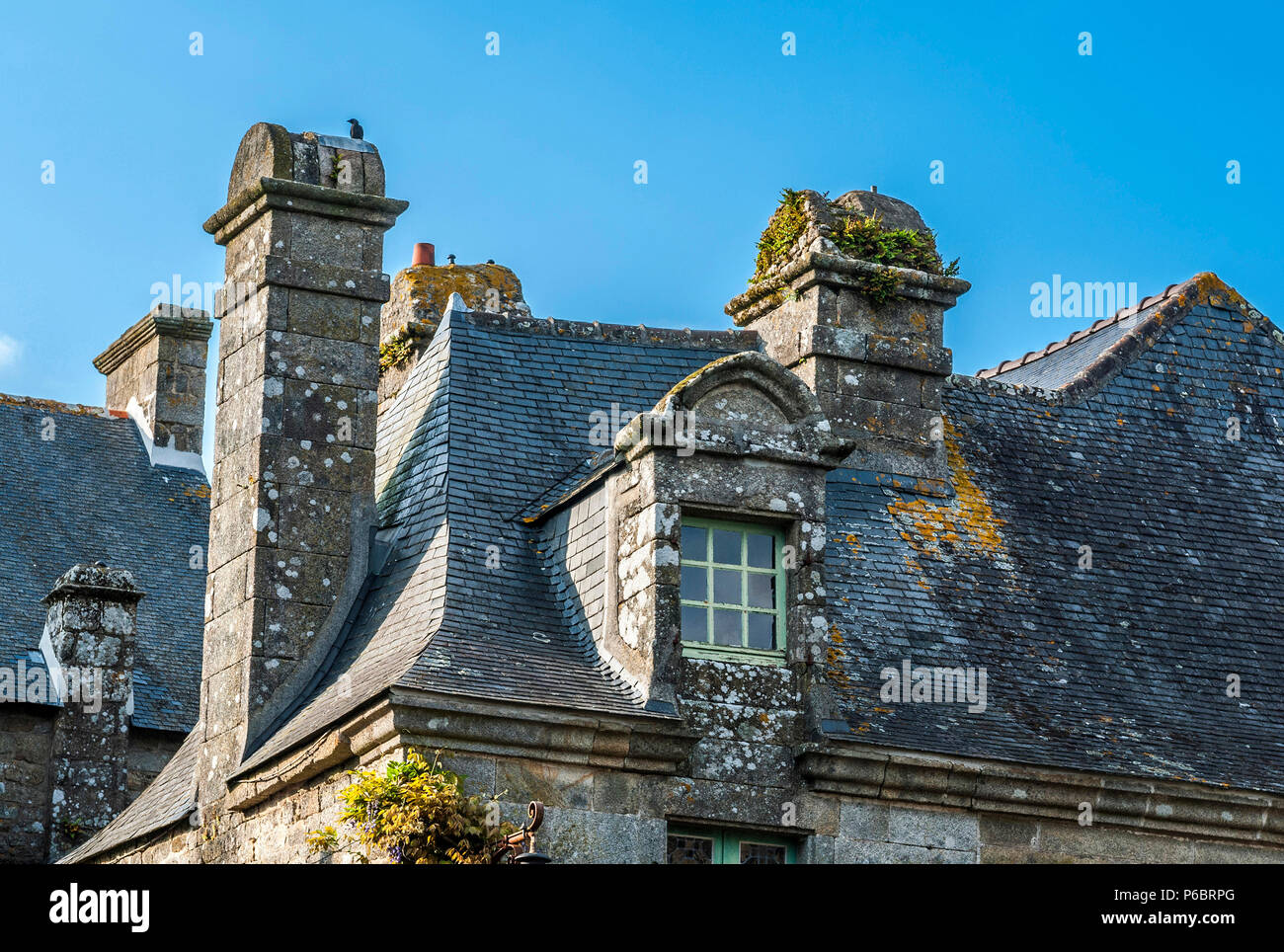 France, Brittany, Finistere, Locronan (labelled 'Most Beautiful Village in France'), skylight and chimneys of a granite house (17th-18th century) Stock Photo