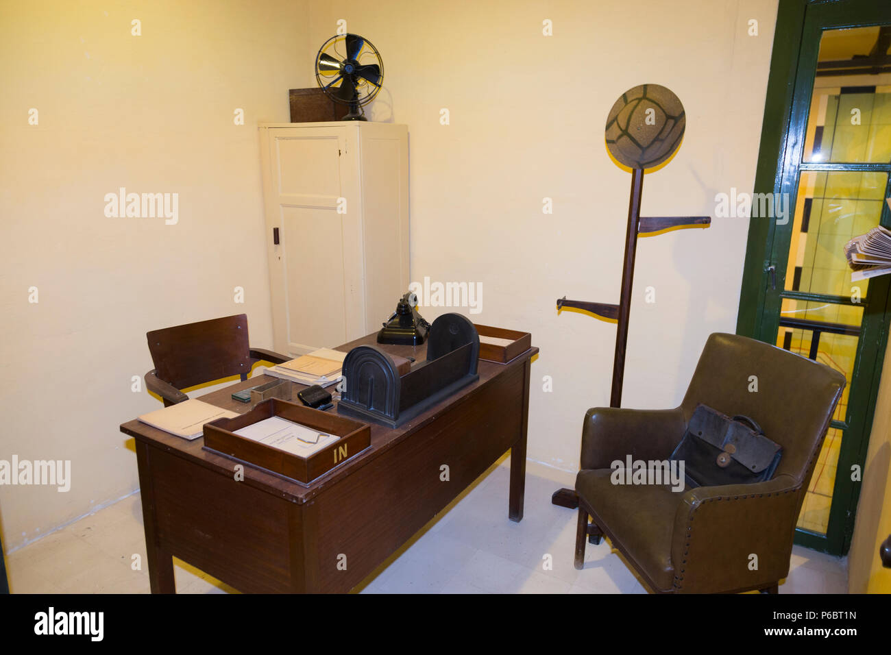 Office with vintage desk, chair and typewriter, and window overlooking