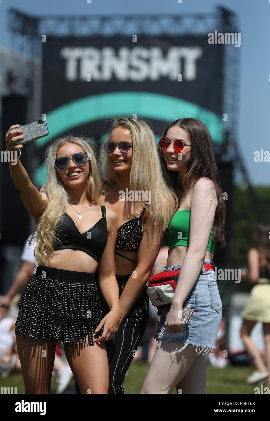 Music fans Annabel Mooney, Millie Rayner and Ella Fraser take a selfie in  front of the main stage at TRNSMT festival in Glasgow Stock Photo - Alamy