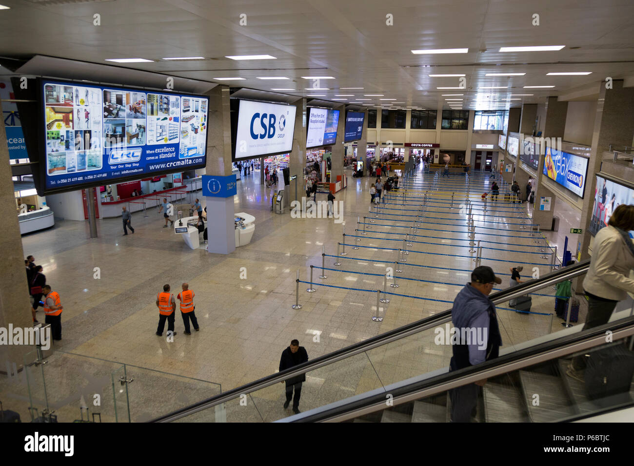 Inside / interior passenger check-in desks / check in area desk in departure  hall / halls of Malta International airport. Island of Malta. (91 Stock  Photo - Alamy