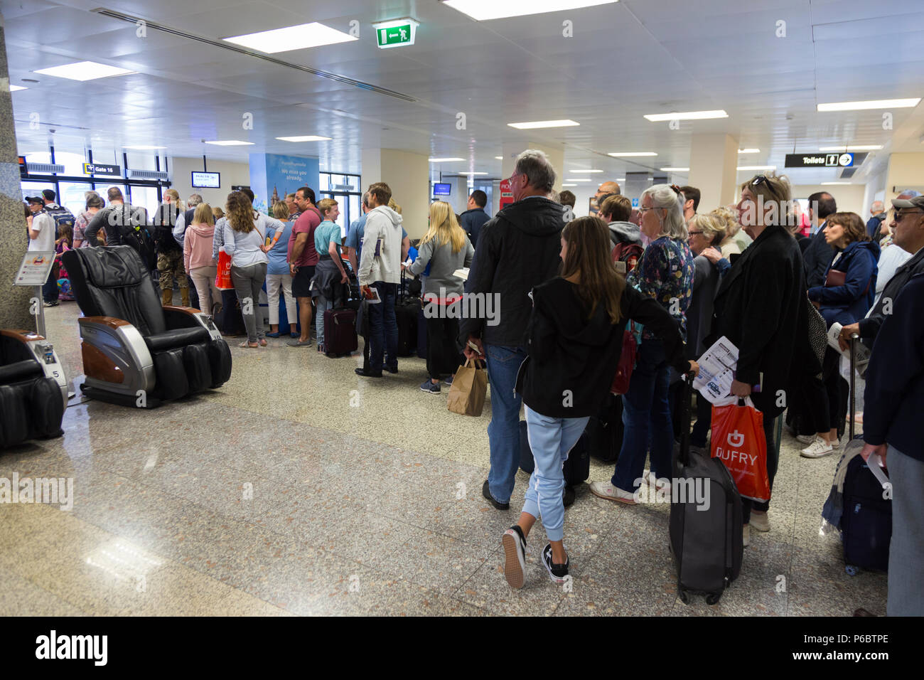 Easyjet passengers in queue / queuing / queues / waiting to board a plane at departure gate 15 at Malta International Airport. (91) Stock Photo