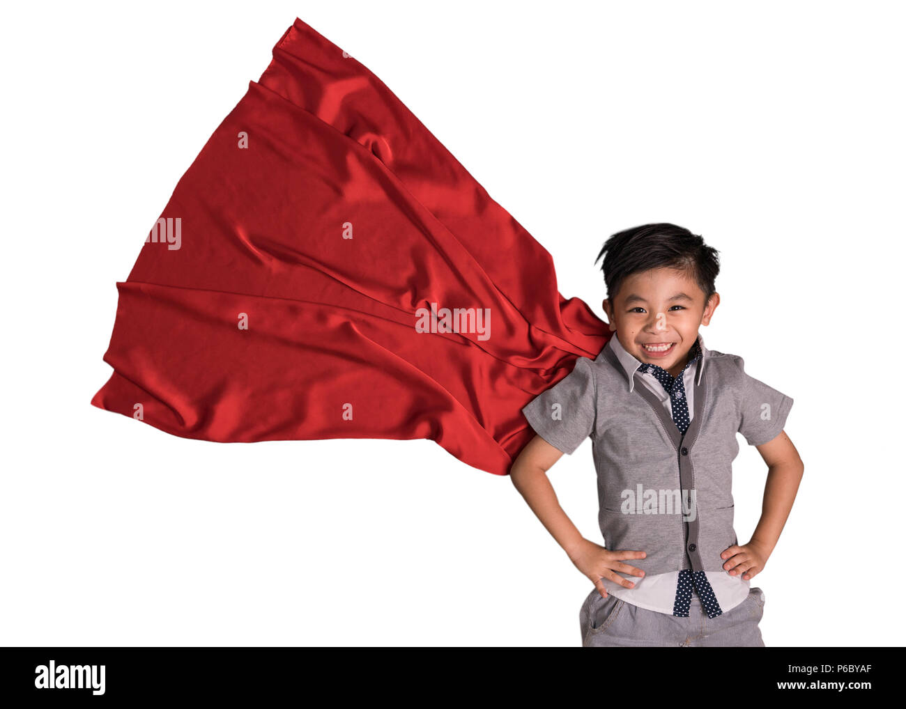 Flying superhero in studio, Child pretend to be superhero, Super hero kid, Success, Creative and imagination concept Stock Photo