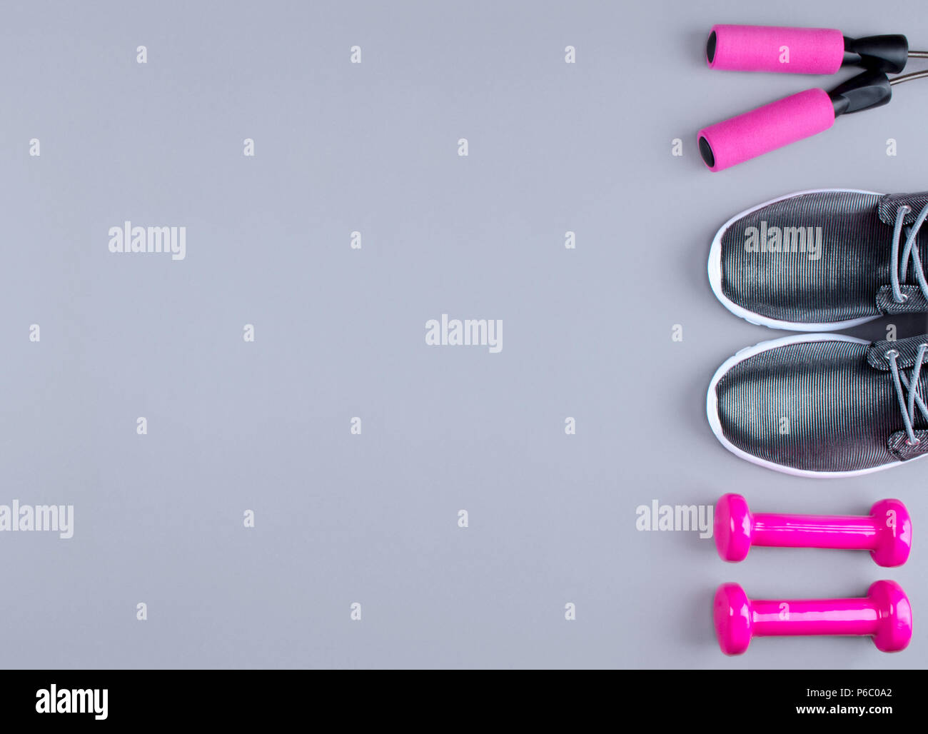 Flat lay shot of sneakers on gray background Stock Photo - Alamy