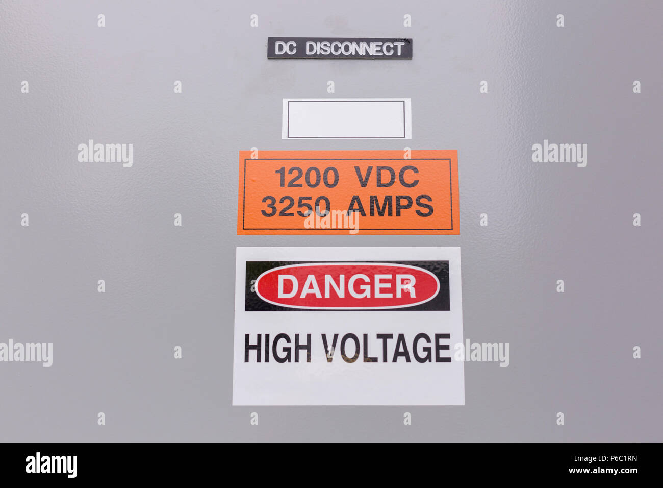 High Voltage sign on DC Disconnect panel Stock Photo